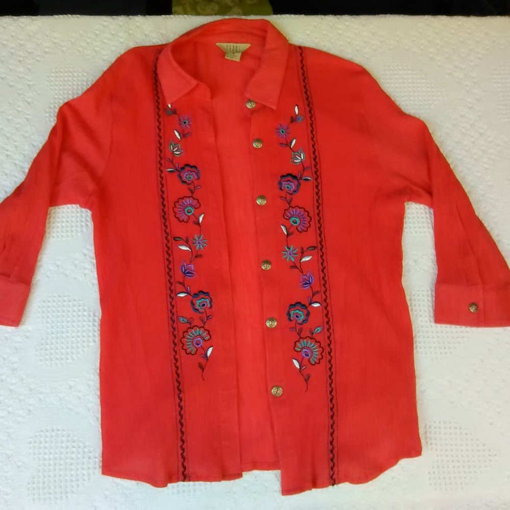 Coral color blouse with silver buttons and sculpted accents